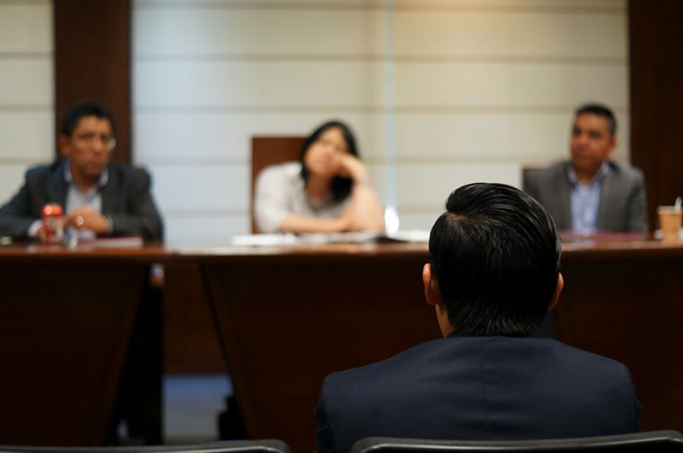 people sitting in a court room
